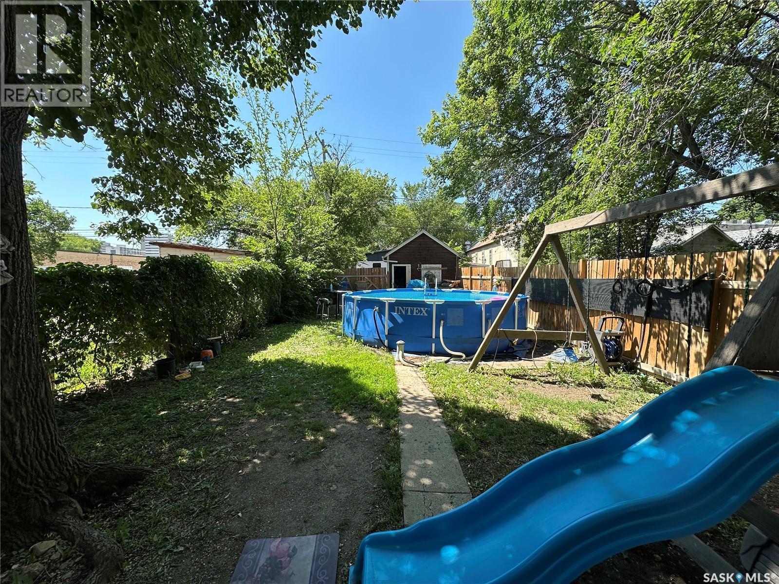 1750 Ottawa Street, Regina, SK - Outdoor With Above Ground Pool With Backyard