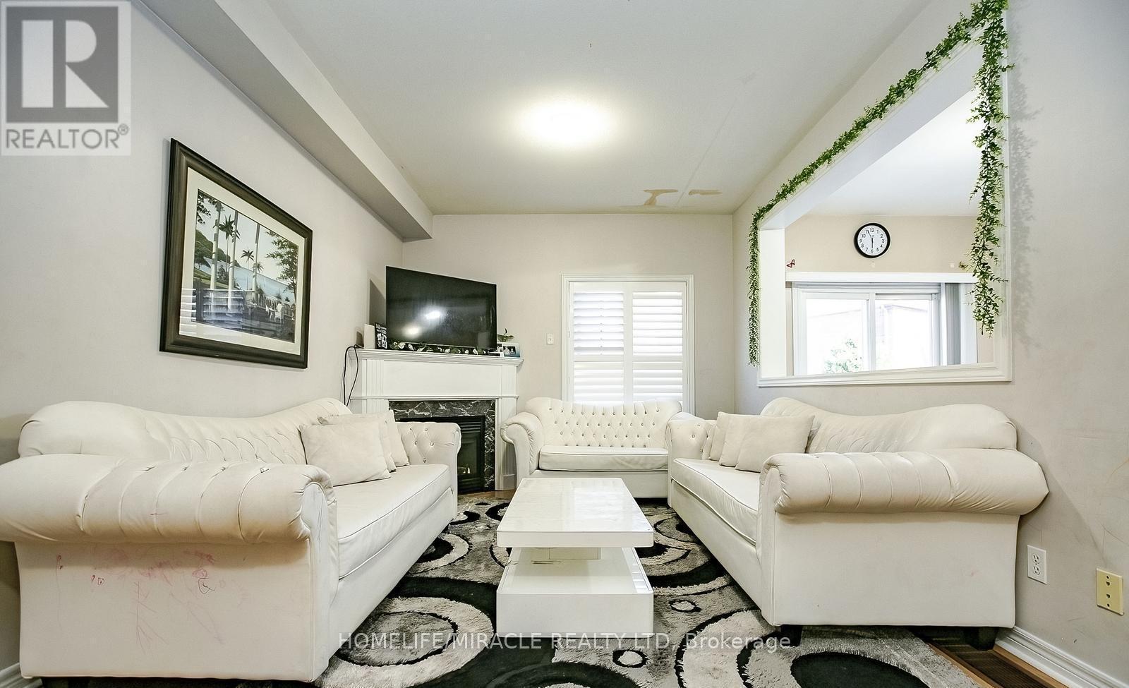 20 Oblate Crescent, Brampton, ON - Indoor Photo Showing Living Room With Fireplace