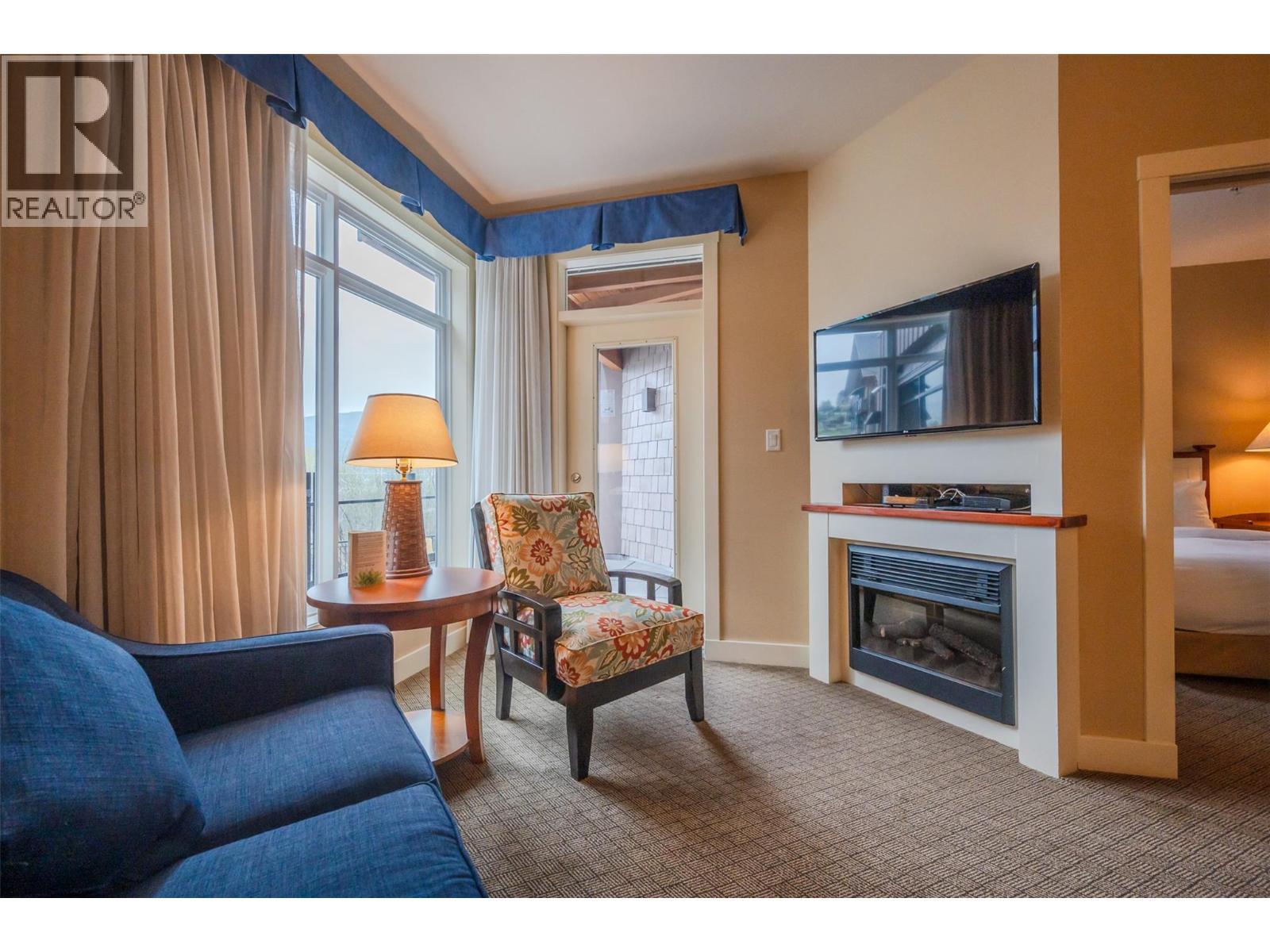 13011 Lakeshore Drive Unit# 105, Summerland, BC - Indoor Photo Showing Living Room With Fireplace