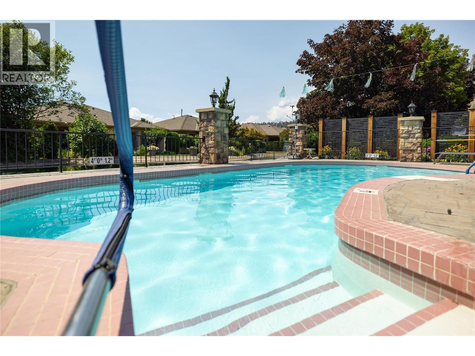 595 Yates Road Unit# 61, Kelowna, BC - Outdoor With In Ground Pool With Backyard