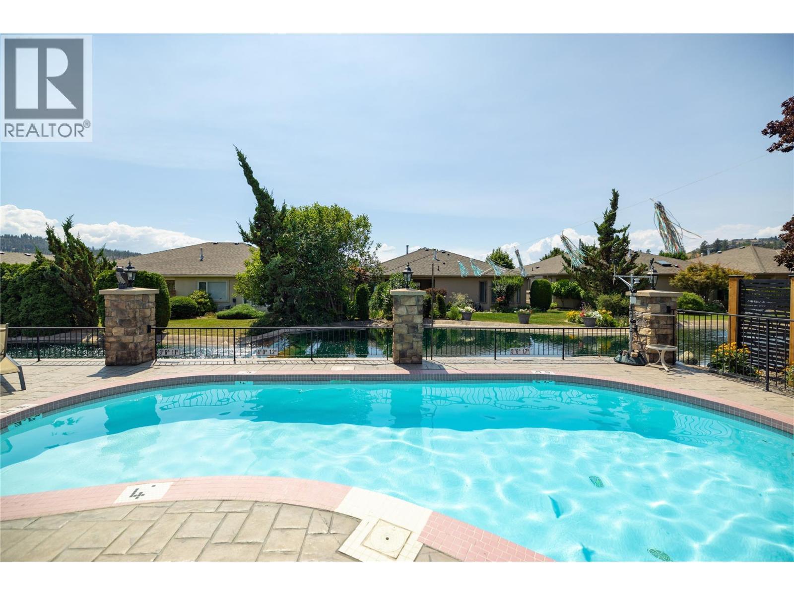 595 Yates Road Unit# 61, Kelowna, BC - Outdoor With In Ground Pool With Backyard