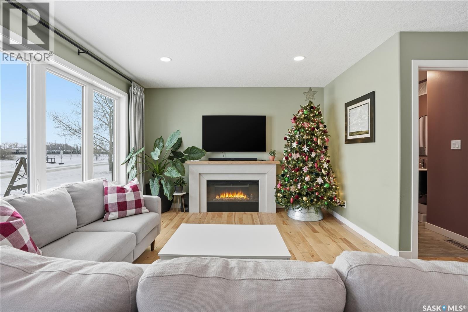 116 North Front Street, Pense, SK - Indoor Photo Showing Living Room With Fireplace