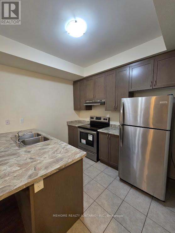 11 - 35 Heron Park Place, Toronto, ON - Indoor Photo Showing Kitchen With Double Sink