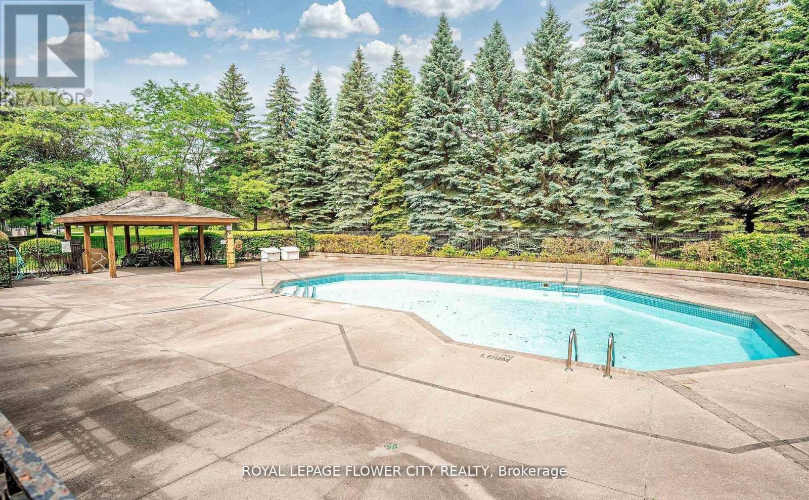 603 - 10 Laurelcrest Street, Brampton, ON - Outdoor With In Ground Pool With Backyard