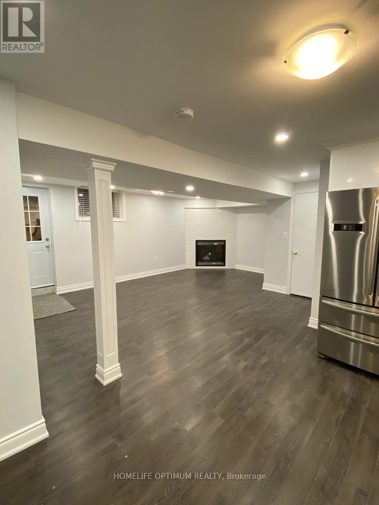 Living room with gas fireplace - 85 Littles Road, Toronto, ON - Indoor