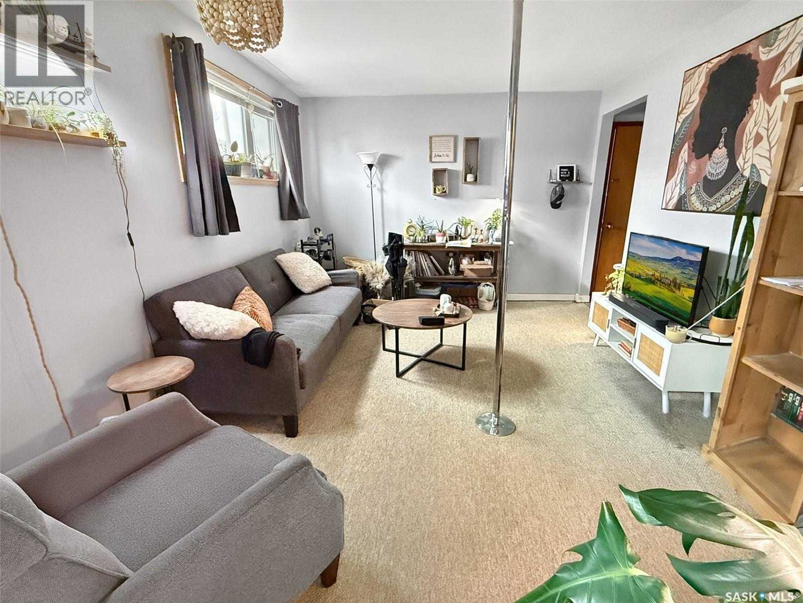 275 Central Avenue S, Swift Current, SK - Indoor Photo Showing Other Room With Fireplace