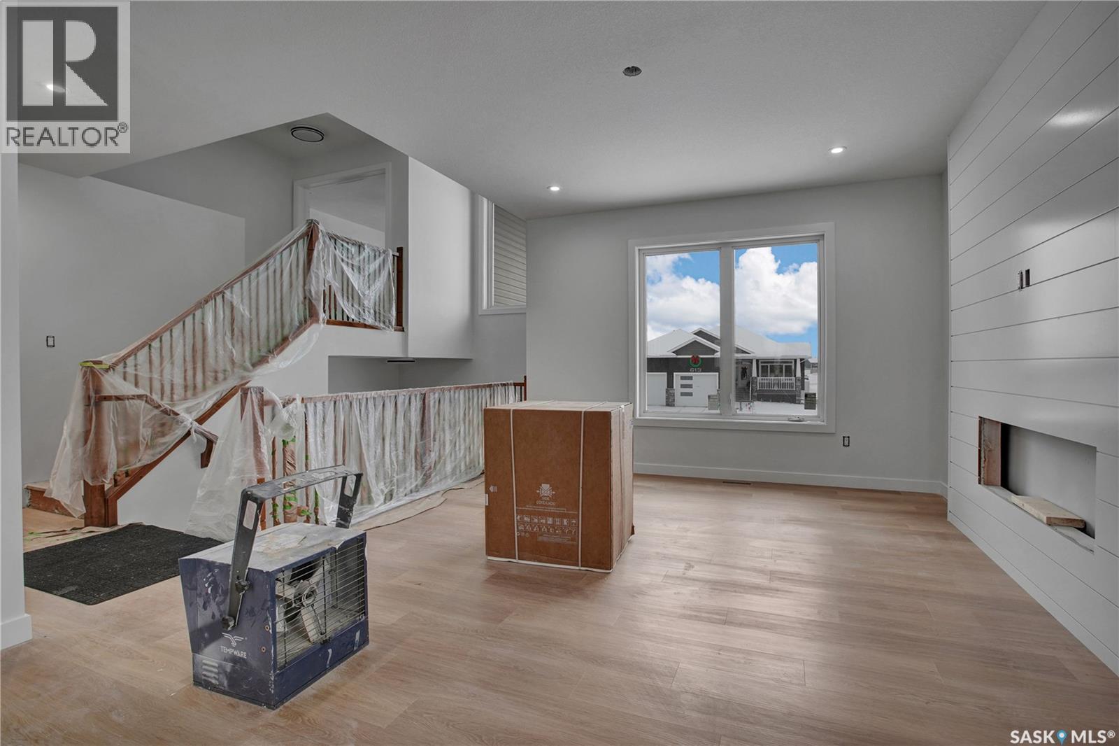 614 Casper Cove, Warman, SK - Indoor With Fireplace