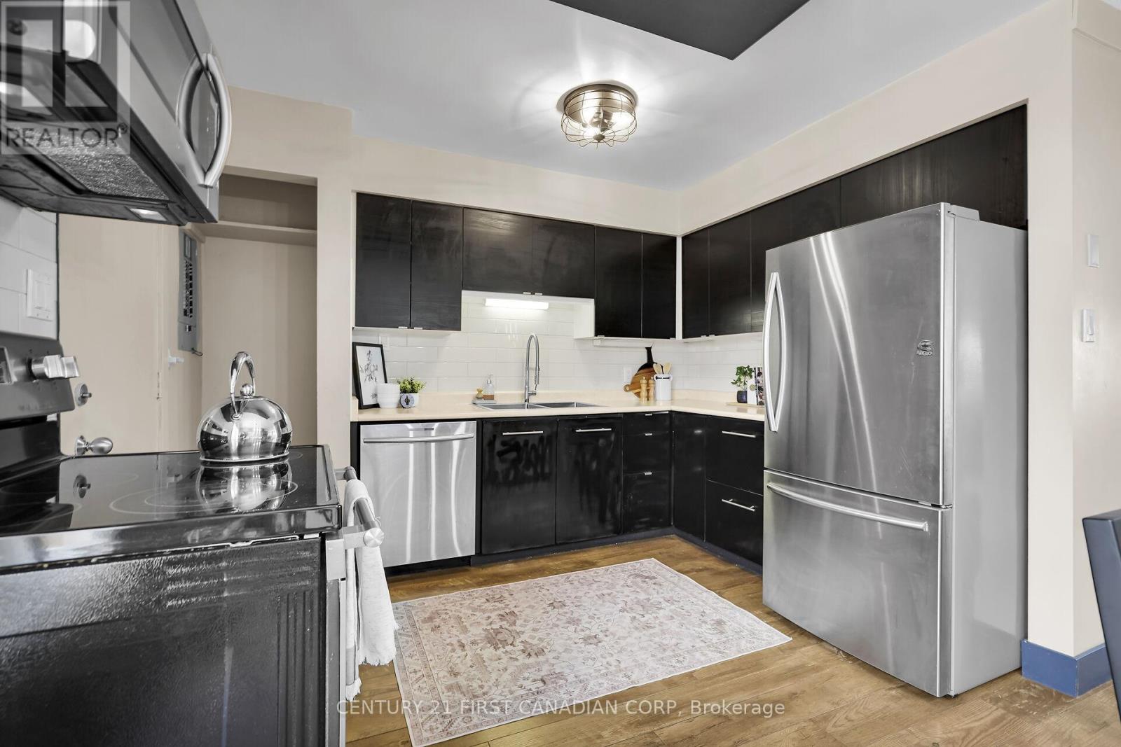 18 - 1138 Kipps Lane E, London East (East A), ON - Indoor Photo Showing Kitchen With Stainless Steel Kitchen