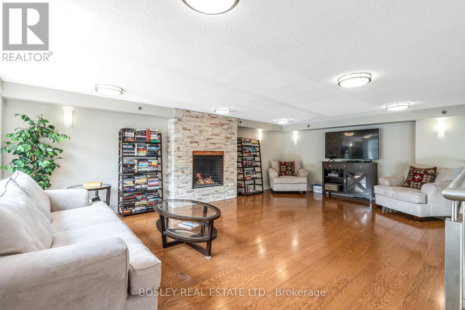 307 - 699 Aberdeen Boulevard, Midland, ON - Indoor Photo Showing Living Room With Fireplace