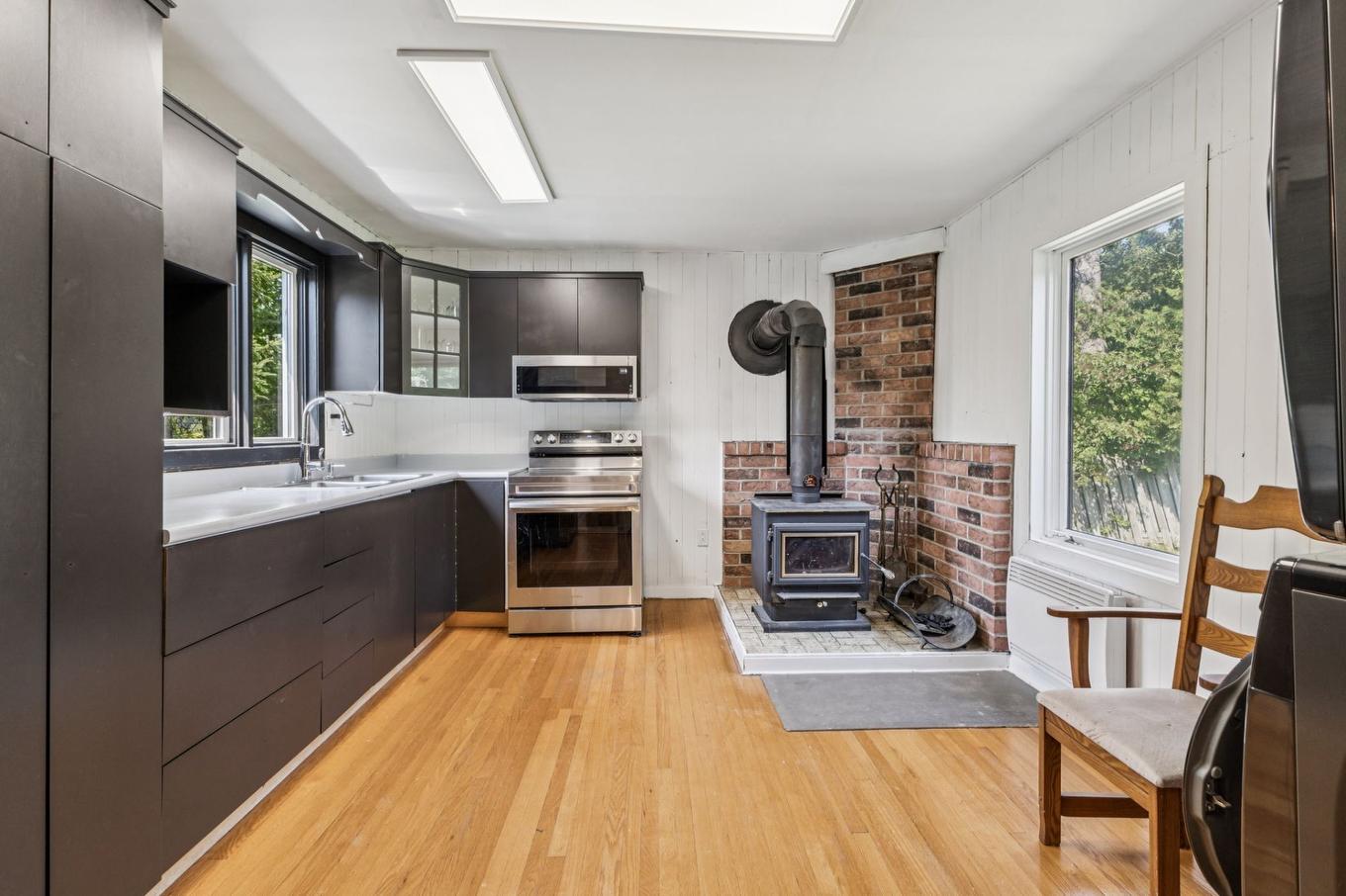 Kitchen - 153 Rue Marleau, Denholm, QC - Indoor Photo Showing Kitchen With Fireplace