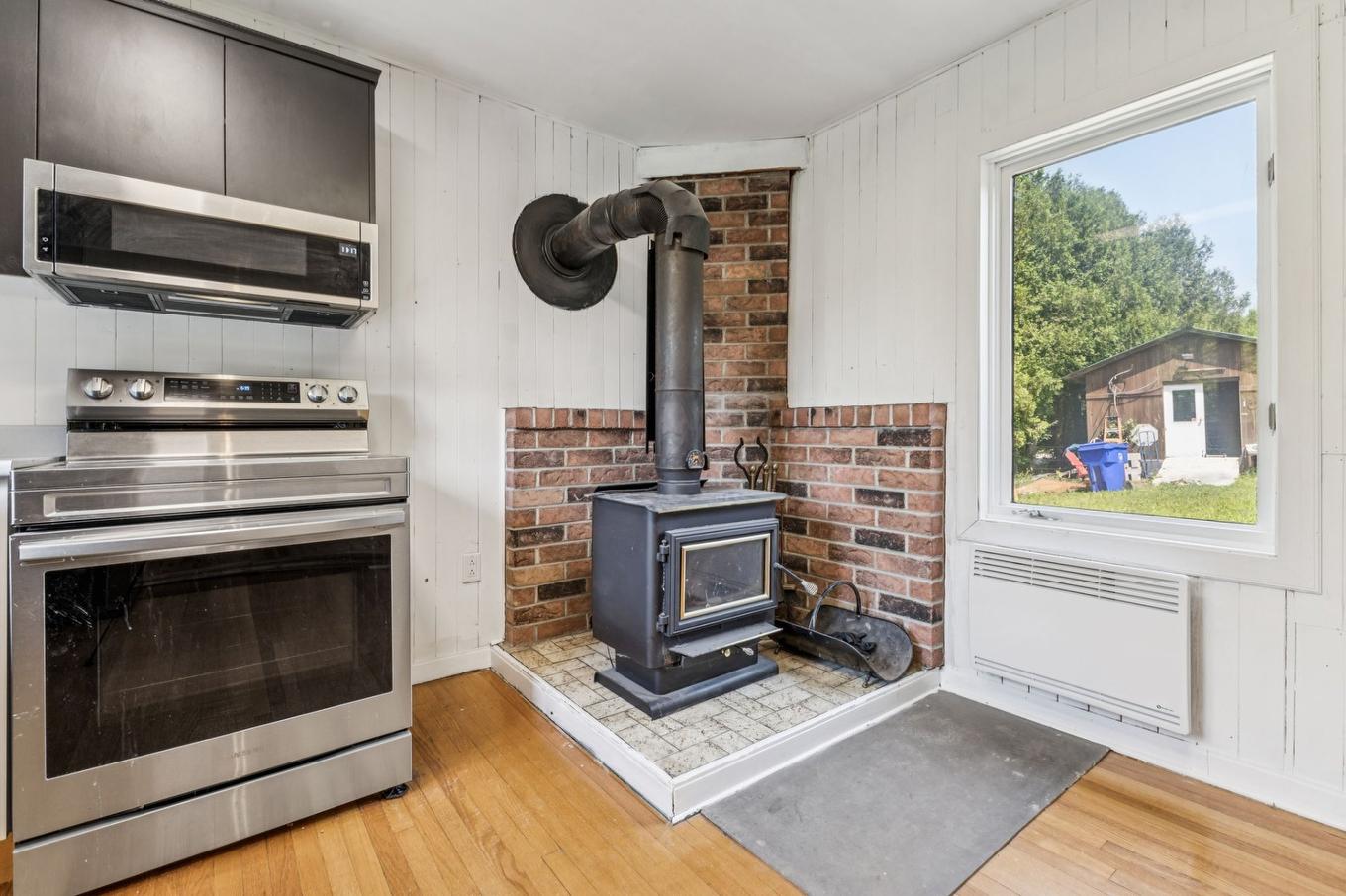 Kitchen - 153 Rue Marleau, Denholm, QC - Indoor With Fireplace