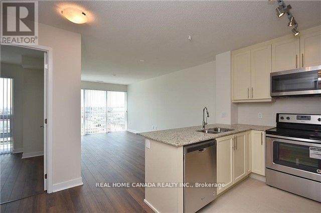 409 - 3975 Grand Park Drive, Mississauga, ON - Indoor Photo Showing Kitchen With Stainless Steel Kitchen With Double Sink