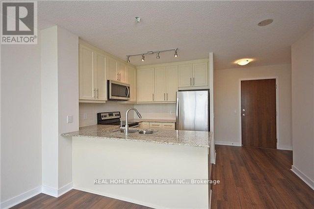 409 - 3975 Grand Park Drive, Mississauga, ON - Indoor Photo Showing Kitchen With Double Sink