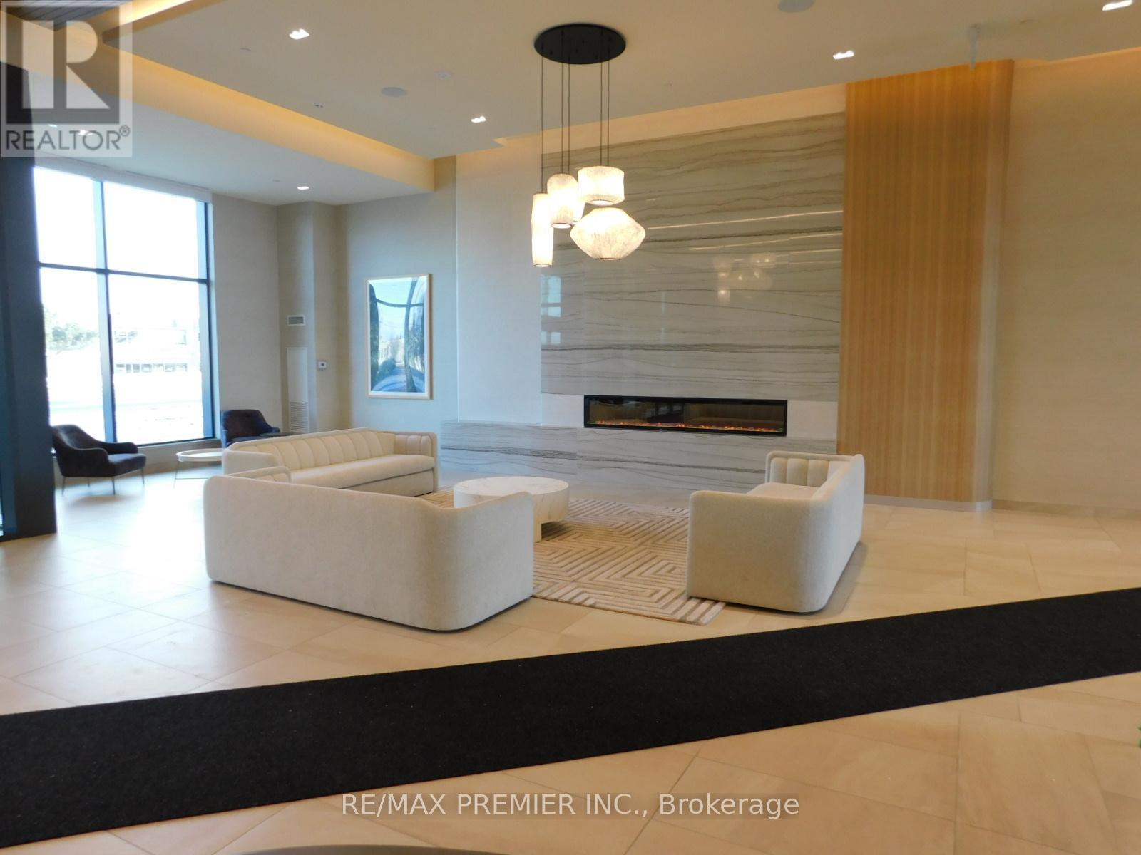 Lobby - 2001 - 8960 Jane Street, Vaughan, ON - Indoor Photo Showing Living Room With Fireplace