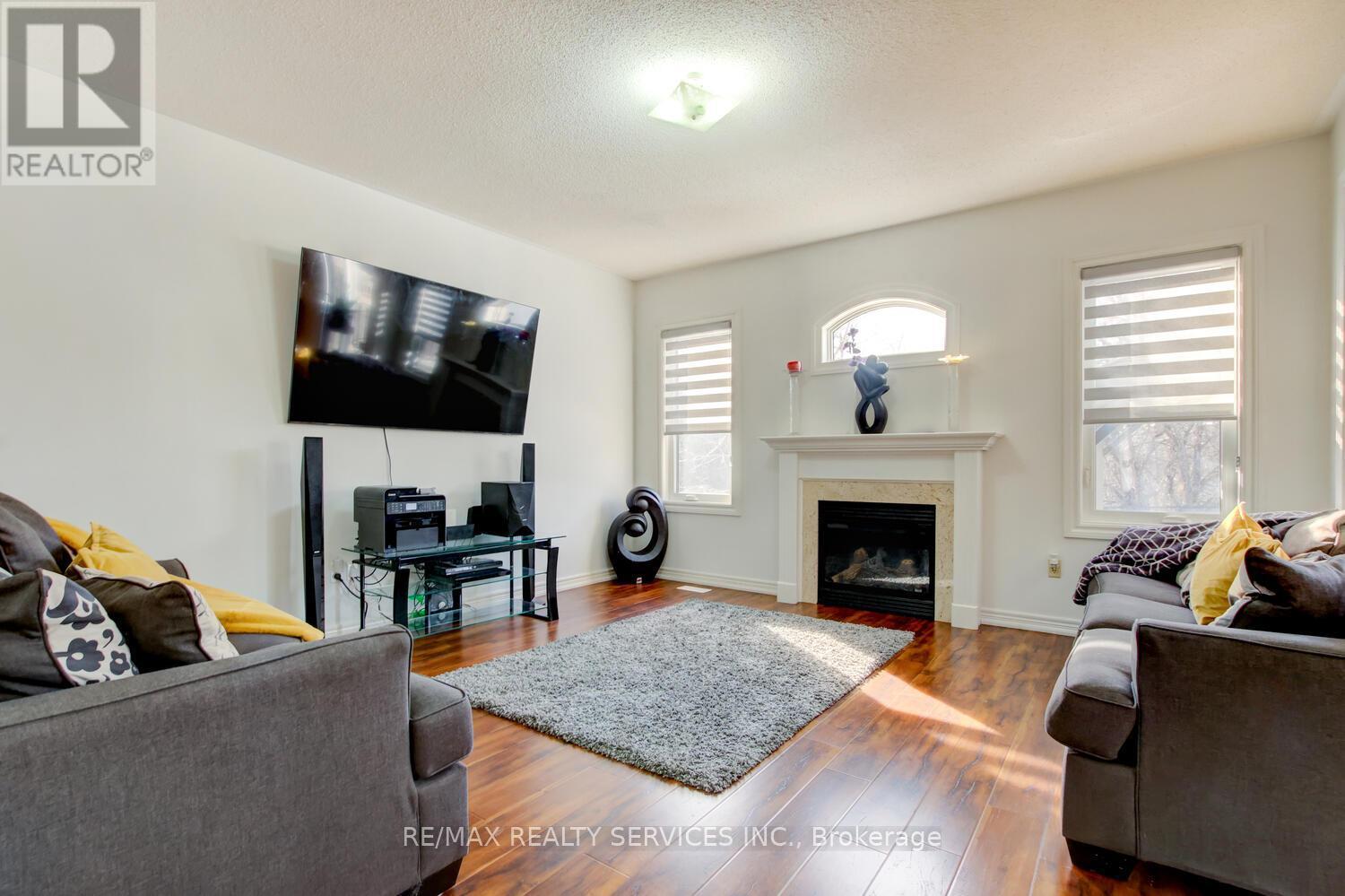 38 Cape Dorset Crescent, Brampton, ON - Indoor Photo Showing Living Room With Fireplace