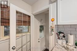 side entrance foyer leading to kitchen and lower -