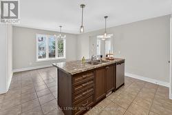 KITCHEN ISLAND OVERLOOKS THE DINING AREA -