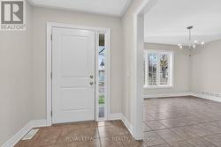 BACK/SIDE ENTRANCE INTO MUD ROOM WITH COAT CLOSET -