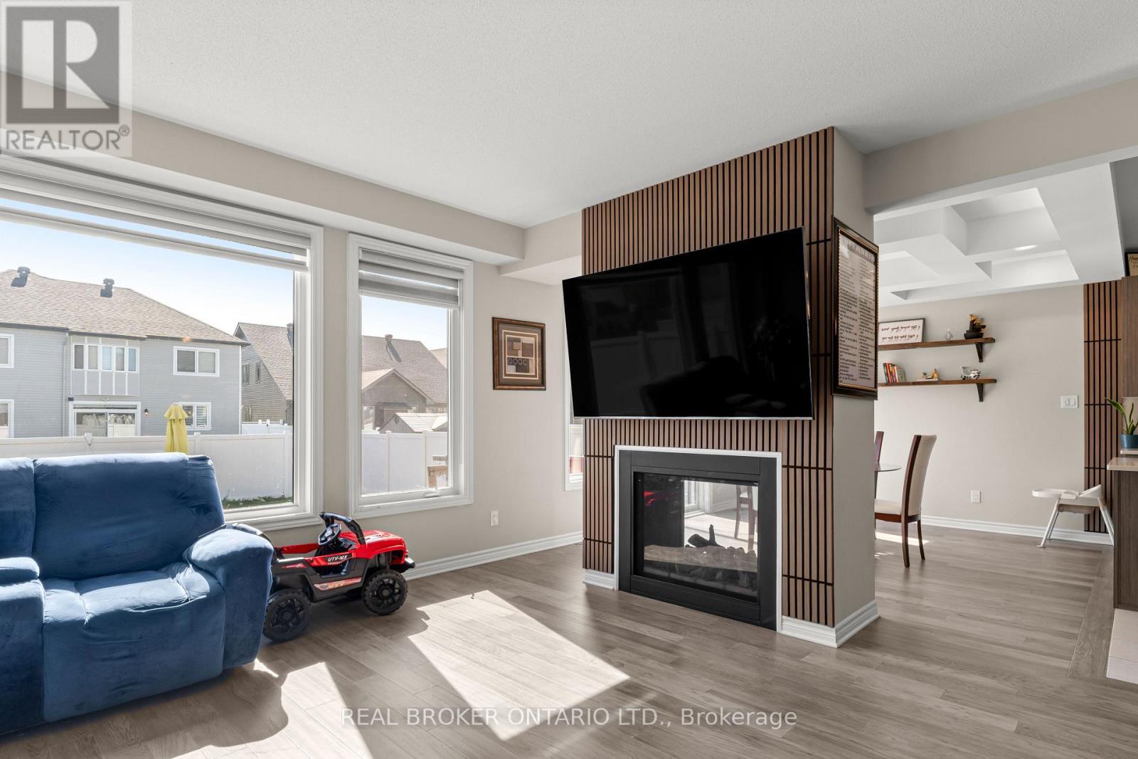 28 Sopwith Private, Ottawa, ON - Indoor Photo Showing Living Room With Fireplace