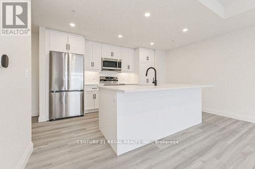 414 - 99B Farley Road, Centre Wellington, ON - Indoor Photo Showing Kitchen With Upgraded Kitchen