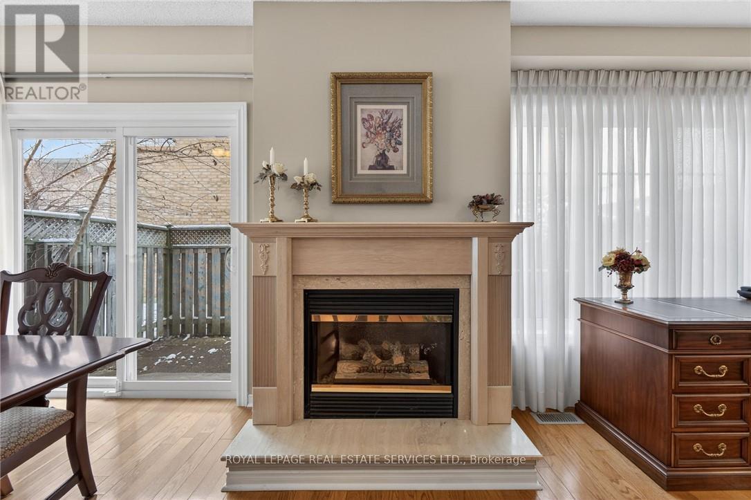 120 - 3333 New Street, Burlington, ON - Indoor Photo Showing Living Room With Fireplace