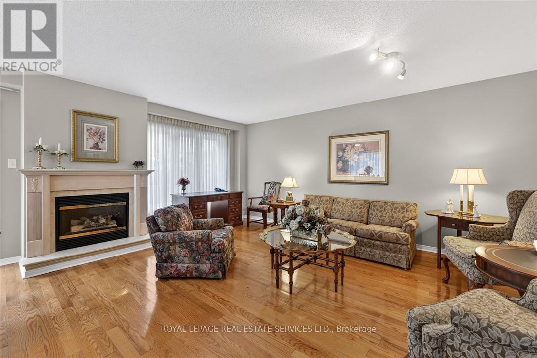 120 - 3333 New Street, Burlington, ON - Indoor Photo Showing Living Room With Fireplace