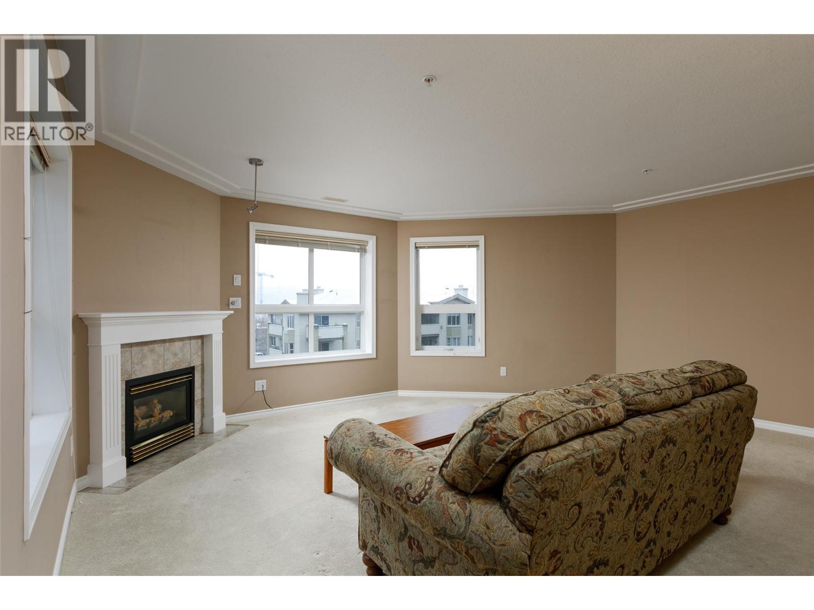 1966 Durnin Road Unit# 501, Kelowna, BC - Indoor Photo Showing Living Room With Fireplace