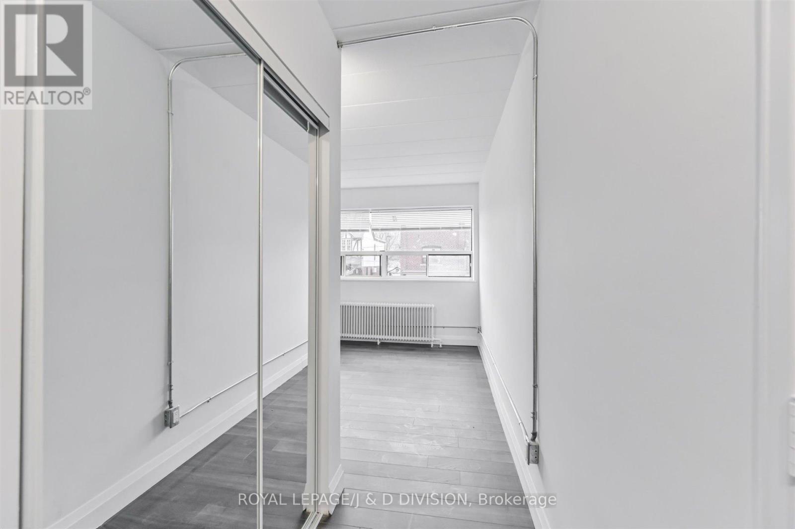 Coat Storage in foyer - 201 - 325 Sammon Avenue, Toronto, ON - Photo Showing Other Room