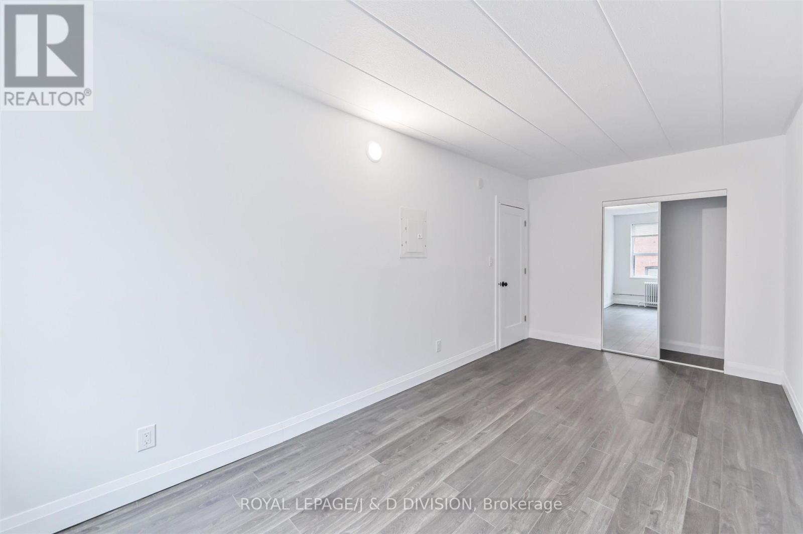 Double closets in primary bedroom - 201 - 325 Sammon Avenue, Toronto, ON - Indoor Photo Showing Other Room