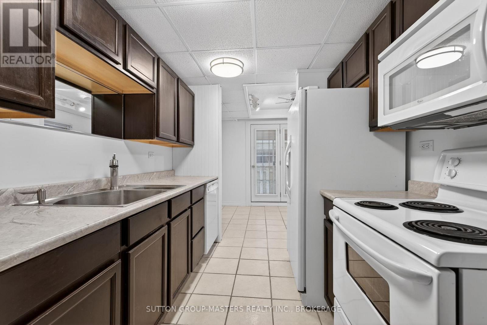 16 Corrigan Street, Kingston (East Of Sir John A. Blvd), ON - Indoor Photo Showing Kitchen With Double Sink
