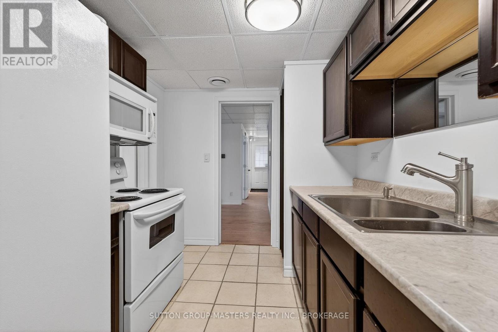 16 Corrigan Street, Kingston (East Of Sir John A. Blvd), ON - Indoor Photo Showing Kitchen With Double Sink