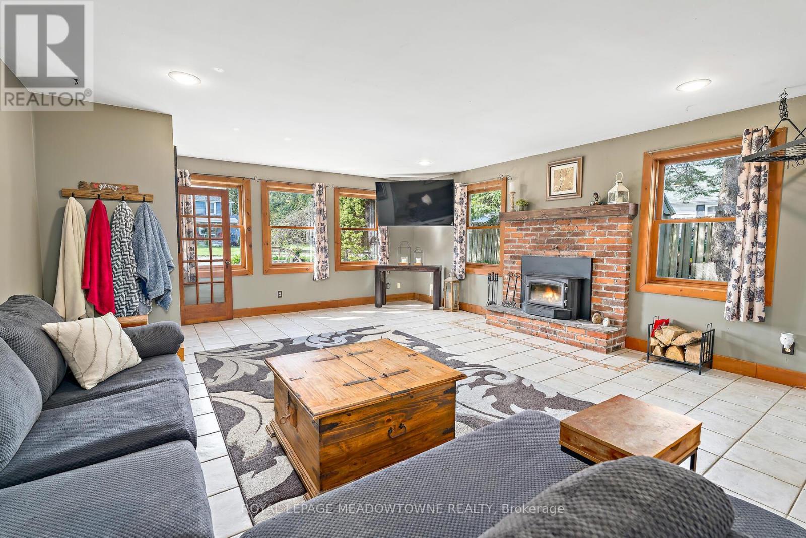 Living Room - 9201 24 Side Road, Erin, ON - Indoor Photo Showing Living Room With Fireplace
