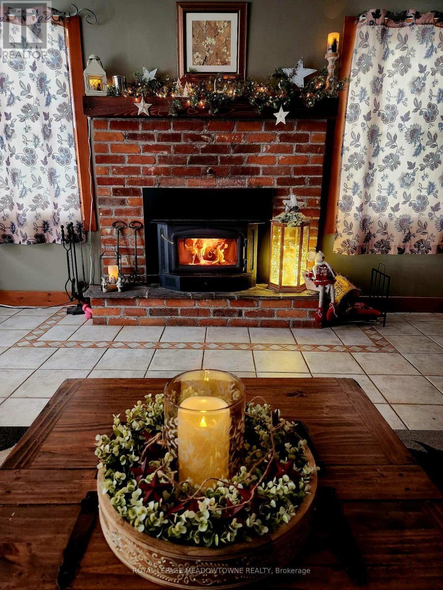 Living Room Fireplace - 9201 24 Side Road, Erin, ON - Indoor With Fireplace