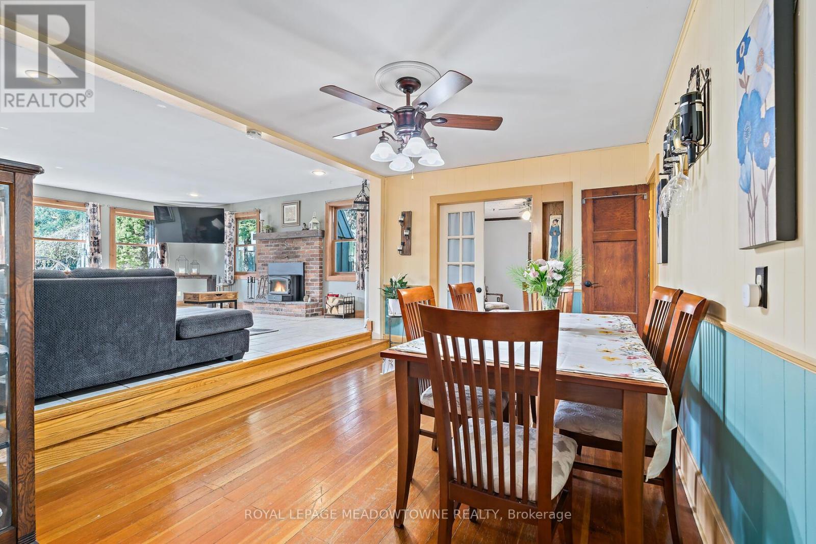 Dining Room / Living Room - 9201 24 Side Road, Erin, ON - Indoor Photo Showing Dining Room With Fireplace