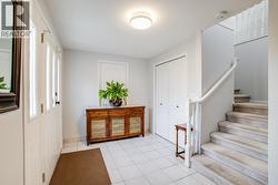 Spacious foyer with access to upstairs & the garage -