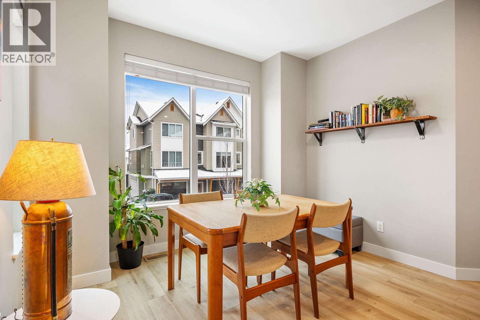 Open concept layout with a dedicated dining area that connects the entire main floor. - 2490 Tuscany Drive Unit# 54, West Kelowna, BC - Indoor Photo Showing Dining Room