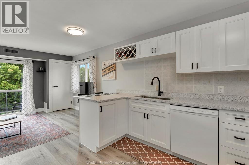 44 Robson Road Unit# 216, Leamington, ON - Indoor Photo Showing Kitchen With Double Sink