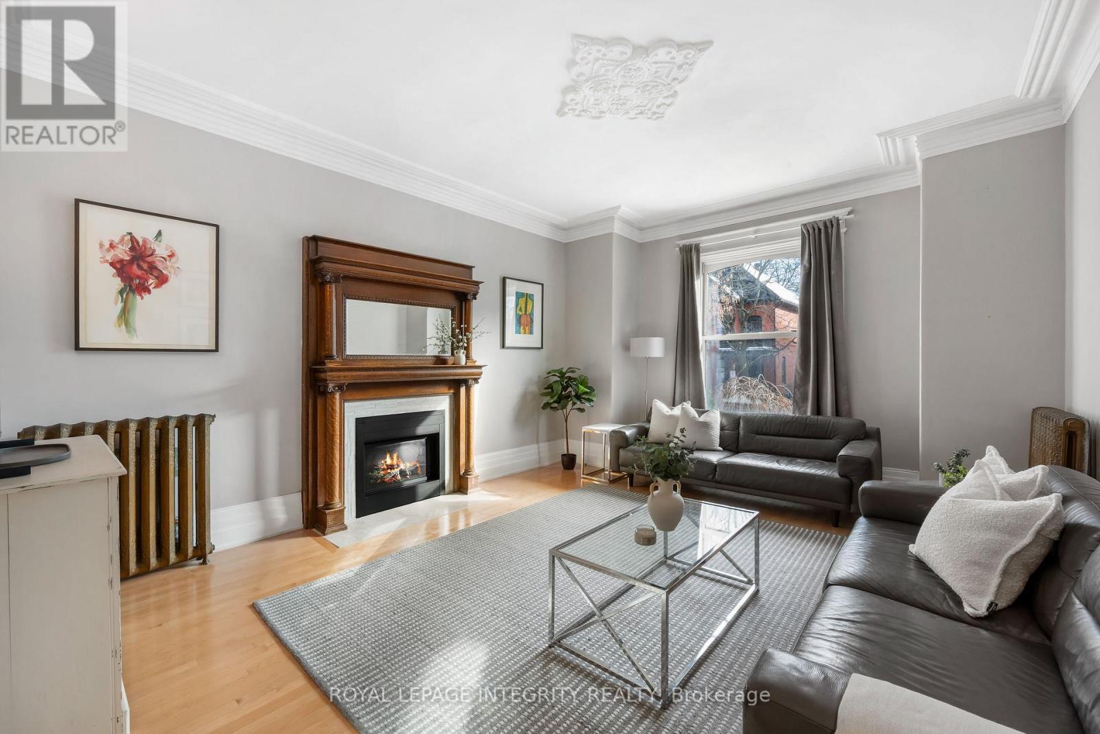 Beautiful living room with a gas fireplace. - 553 Gilmour Street, Ottawa, ON - Indoor Photo Showing Living Room With Fireplace