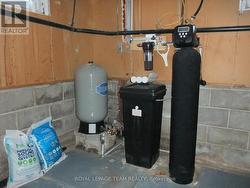 Newer water treatment and pressure tank. -