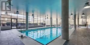 Pool 2 - 1628 - 38 Joe Shuster Way, Toronto, ON - Photo Showing Other Room With In Ground Pool