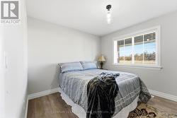 bedroom 1 w/closet and access to washroom across -