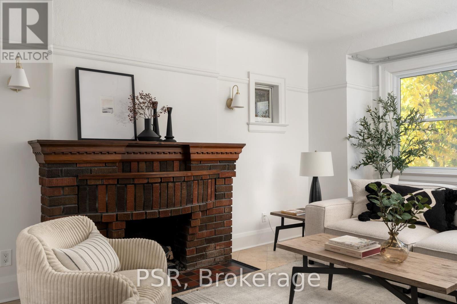217 Northcliffe Boulevard, Toronto, ON - Indoor Photo Showing Living Room With Fireplace
