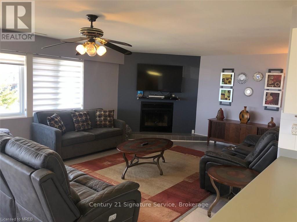 60 - 209472 Highway 26 W, Collingwood, ON - Indoor Photo Showing Living Room With Fireplace