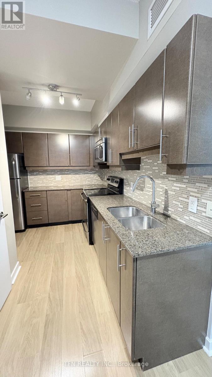 504 - 33 Bay Street, Toronto, ON - Indoor Photo Showing Kitchen With Double Sink With Upgraded Kitchen