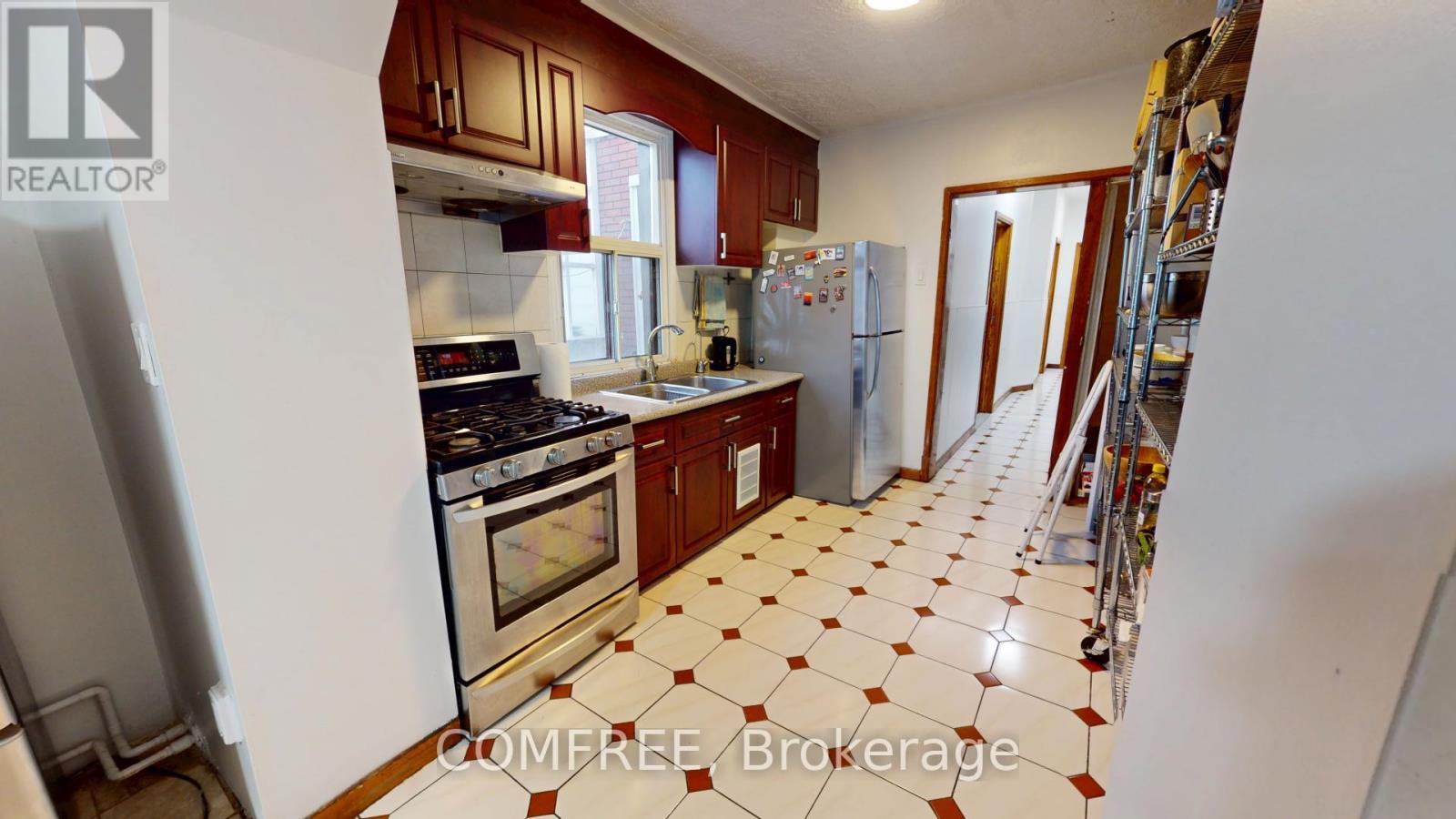 36 Mitchell Avenue, Toronto (Niagara), ON - Indoor Photo Showing Kitchen With Double Sink