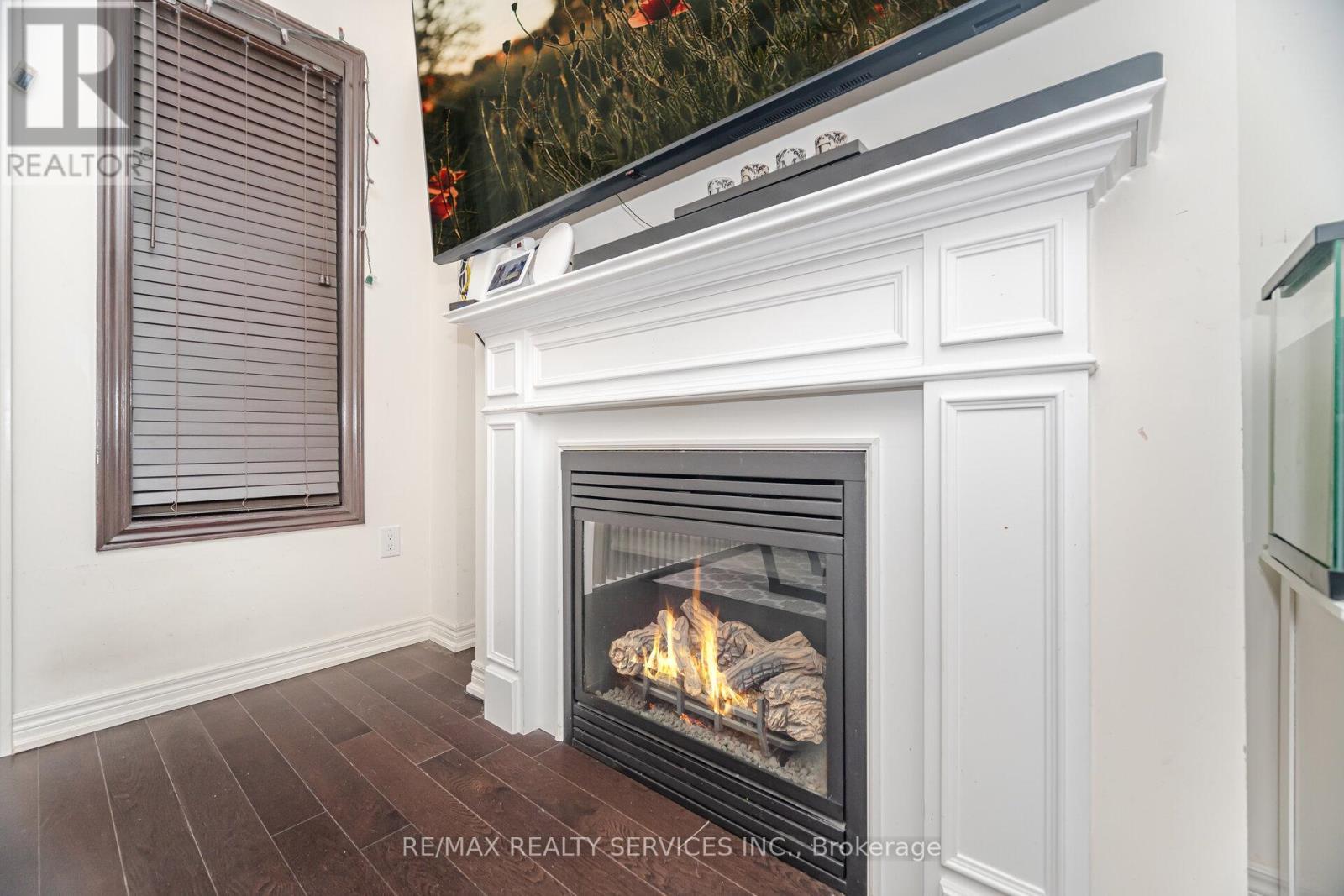 7 Dufay Road, Brampton, ON - Indoor Photo Showing Living Room With Fireplace