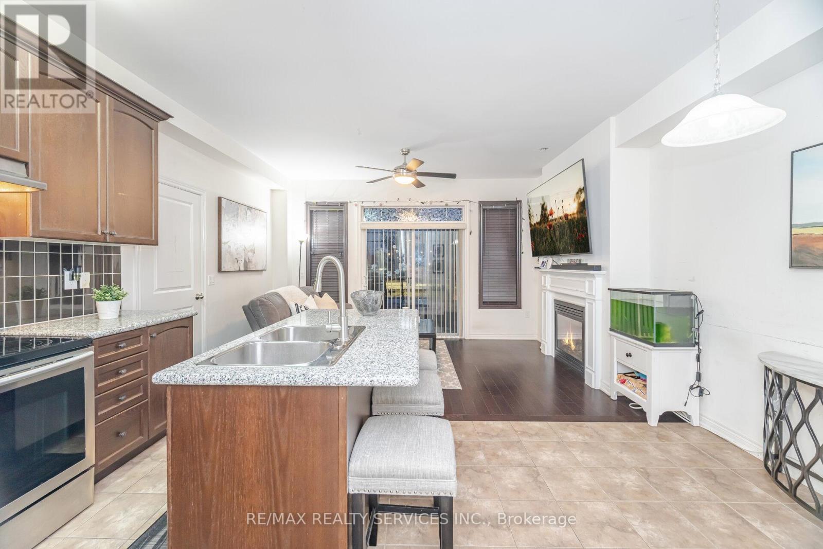 7 Dufay Road, Brampton, ON - Indoor Photo Showing Kitchen With Double Sink