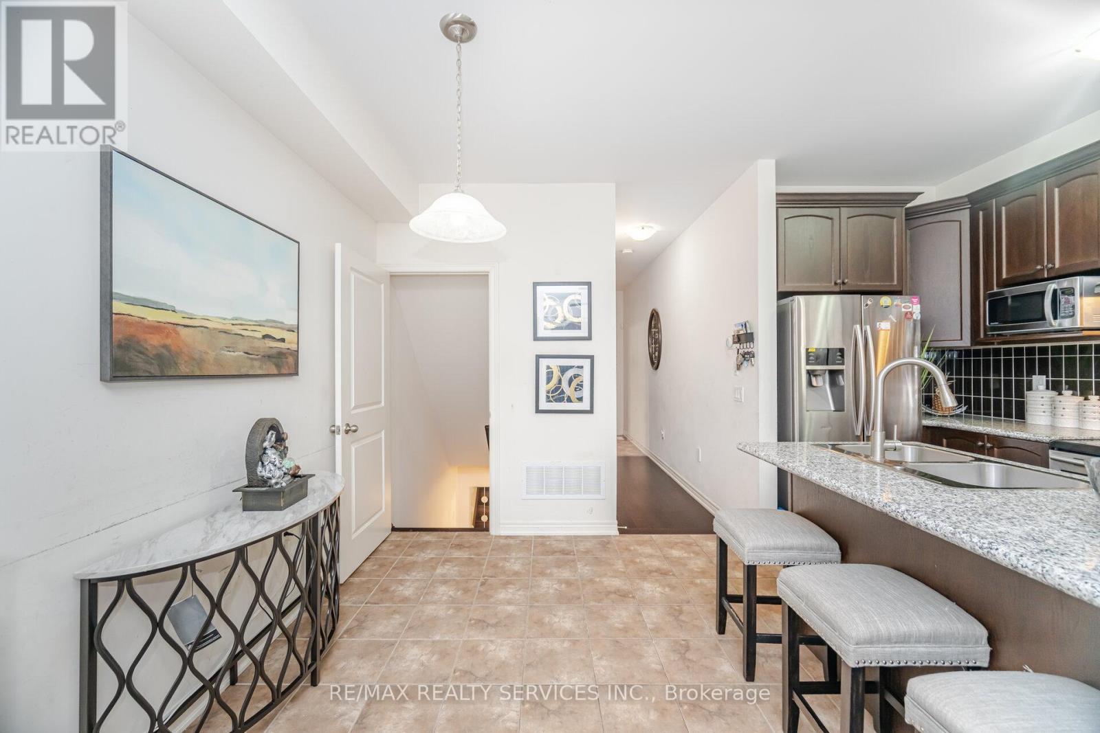 7 Dufay Road, Brampton, ON - Indoor Photo Showing Kitchen With Double Sink