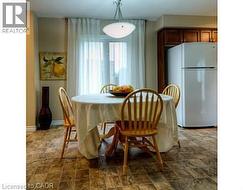 Dining area featuring stone finish flooring -