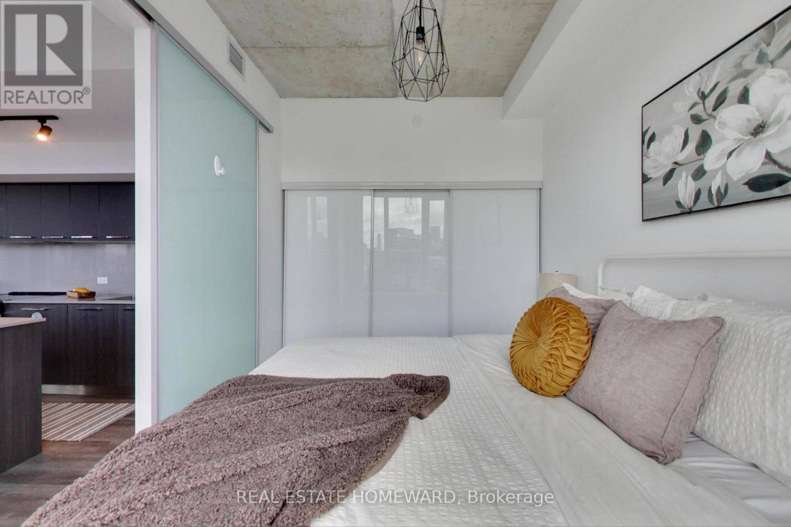 with wall-to-wall closet - 1113 - 30 Baseball Place, Toronto, ON - Indoor Photo Showing Bedroom